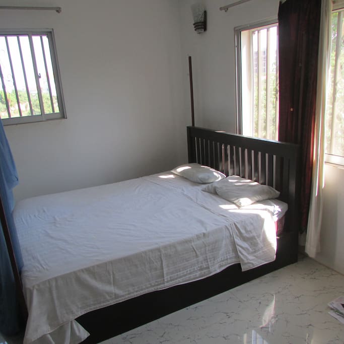 Upstairs bedroom 2, queen bed with latex mattress underlay for extra comfort, a/c, bathroom with toilet, shower and vanity and lockable door