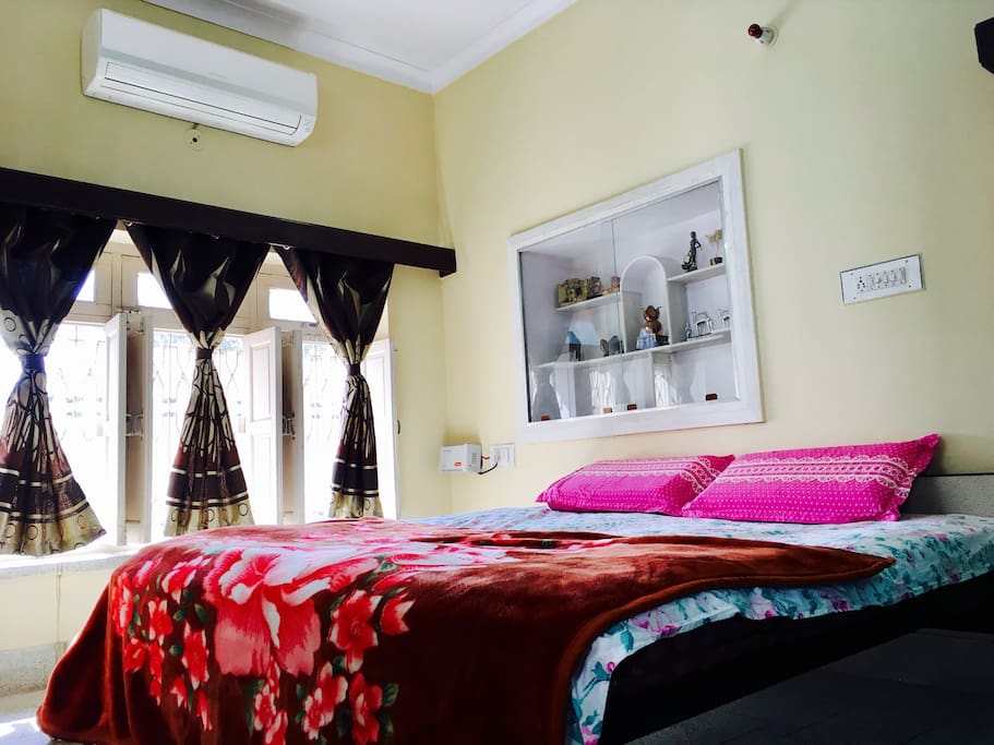Chip: A relaxing cream color painted room comes with AC newly fitted AC not notch O'General Air conditioner. This room sports a huge entire wall set window with a beautiful garden view. The room also has mat white colored royal wooden word.