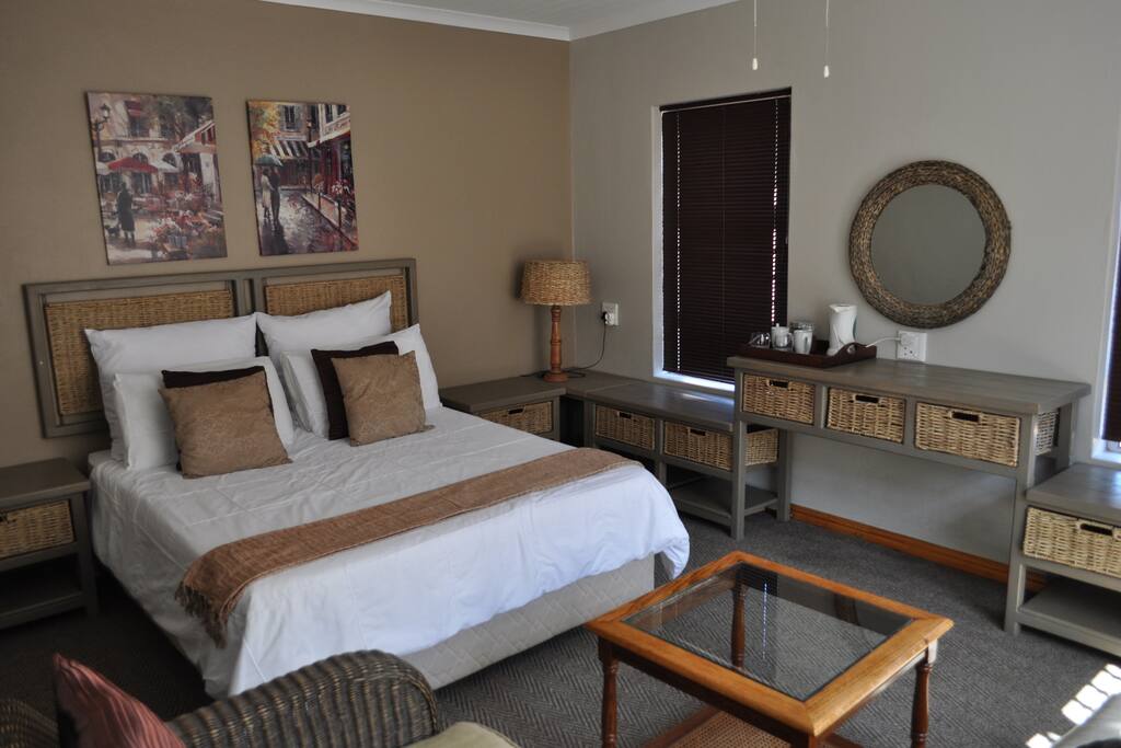 Bedroom and bathroom with toilet, shower and basin