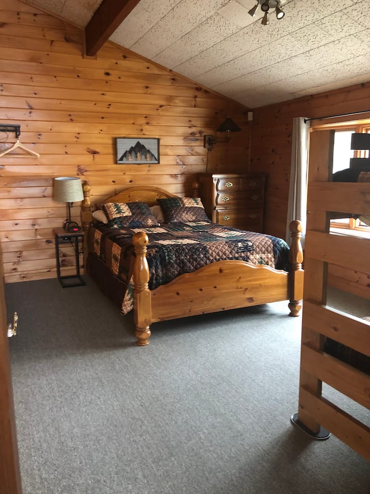 Bedroom with one queen bed and twin bunk beds. Can sleep 4 in here.