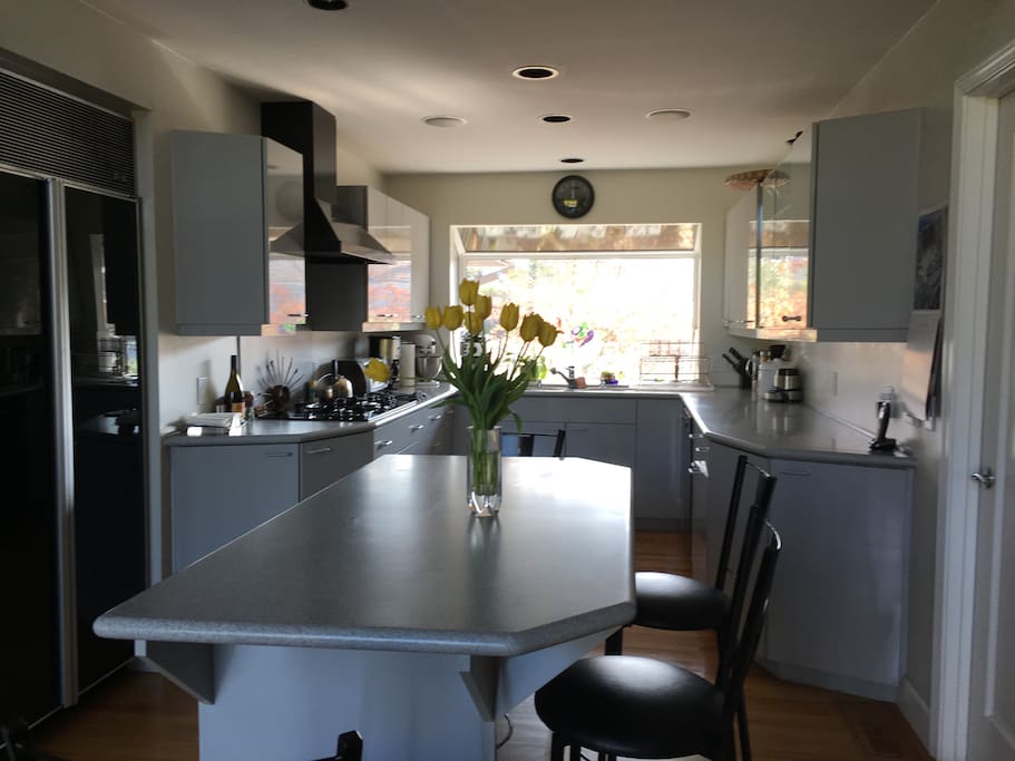 Kitchen with island and barstools