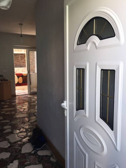 Secure and safe front door leading to the open space corridor