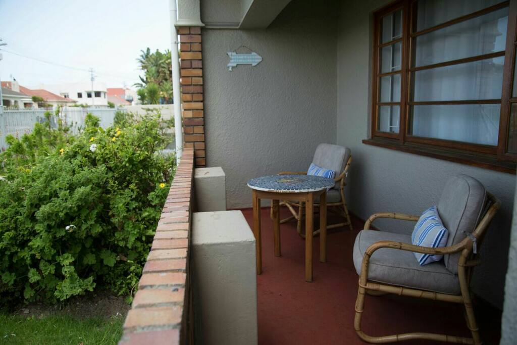 Patio onto small garden with view of Vlei