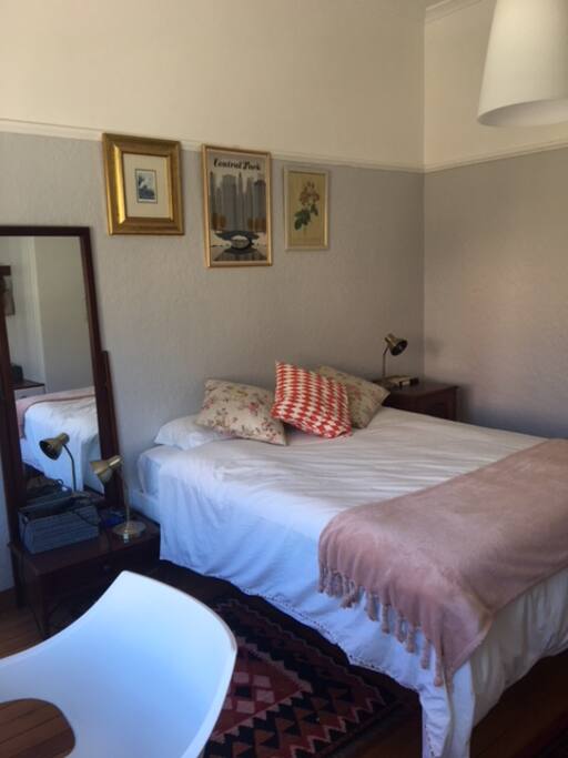 Spacious, lovely bedroom opening onto a balcony
