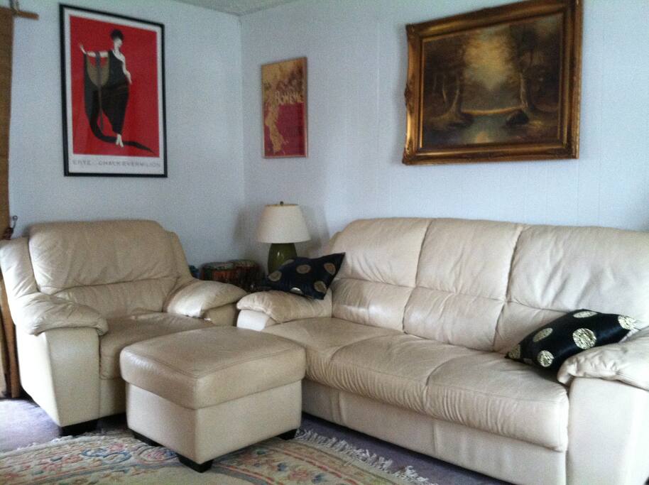 Overstuffed leather couches and original art provide an attractive place to read, relax or socialize with your host.