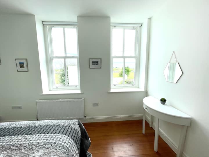Bedroom 2 has spacious fitted wardrobes & garden views. 