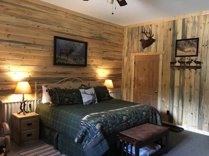 The Bull Elk Bedroom - King Suite. King-size Bed, Full-size Sofa Bed, Twin Roll-away Bed. Private Bath with Walk-in Shower - Sitting Area, Microwave and Mini-Fridge, Flat Screen TV,  Fireplace. Sleeps 5