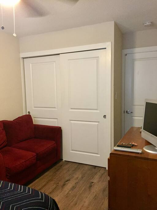 Facing closet and bedroom door