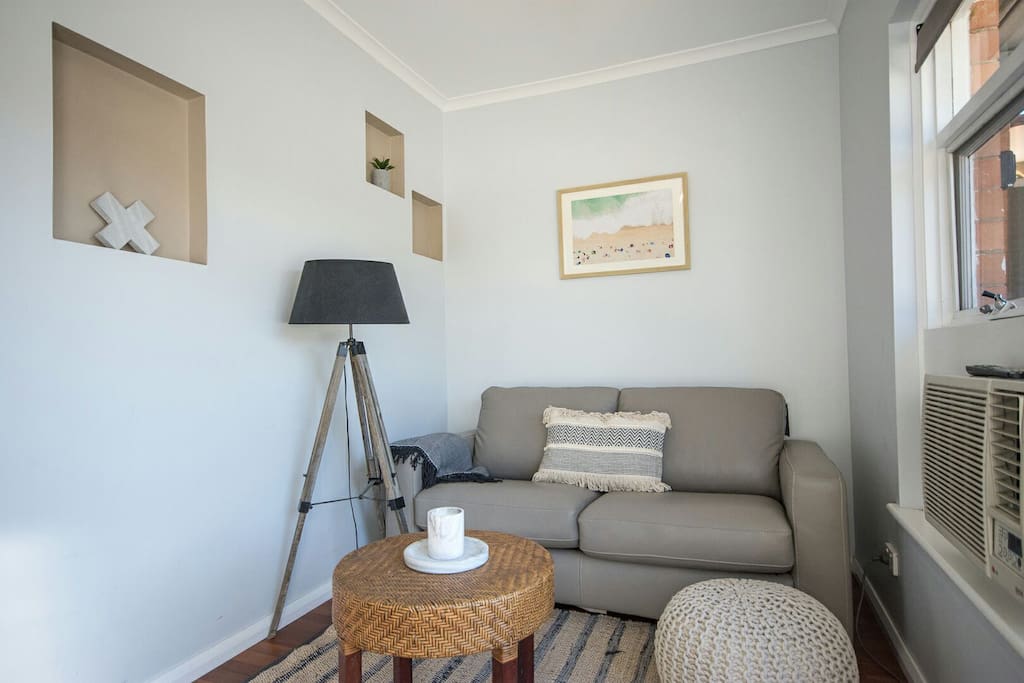 The leather sofa converts to a double sofa bed.