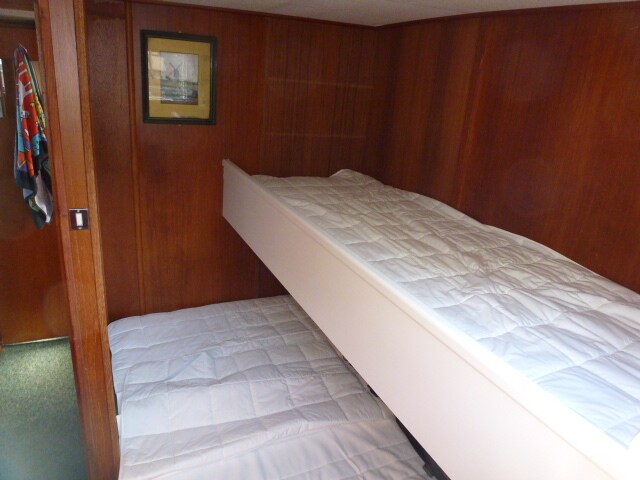 Double bed and single bunk in the bunk room