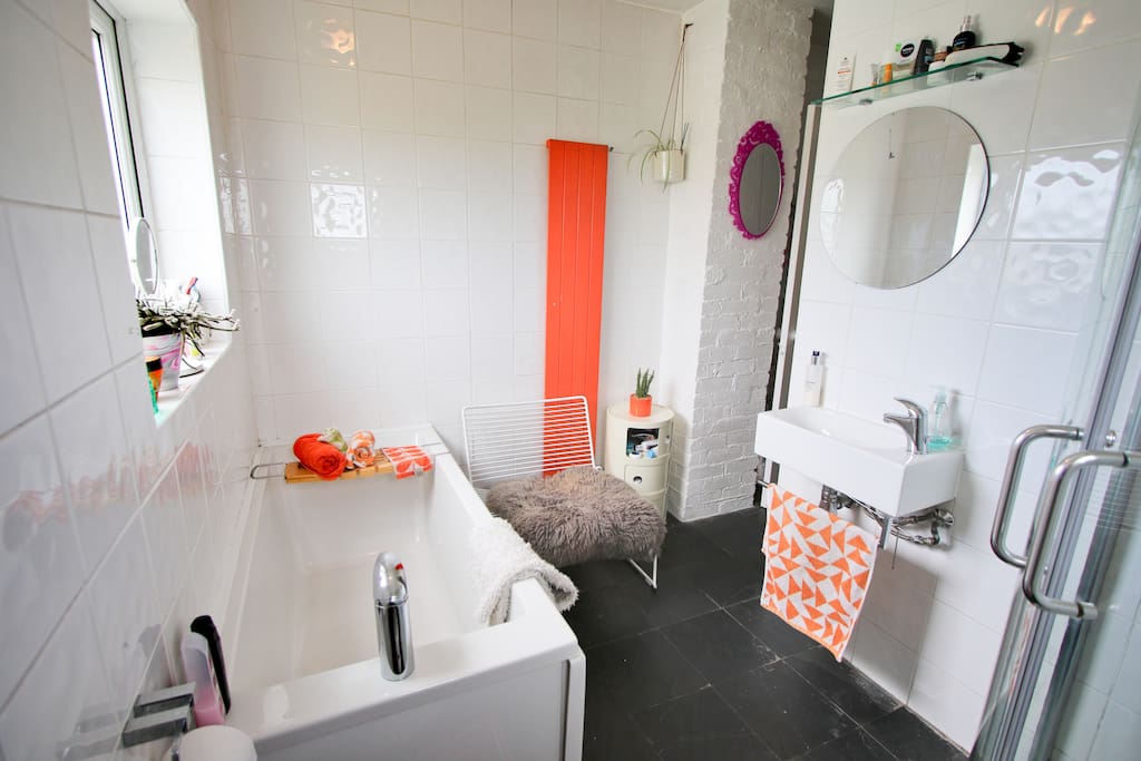 Shared bathroom with bath, shower and sink. Towels will be supplied.