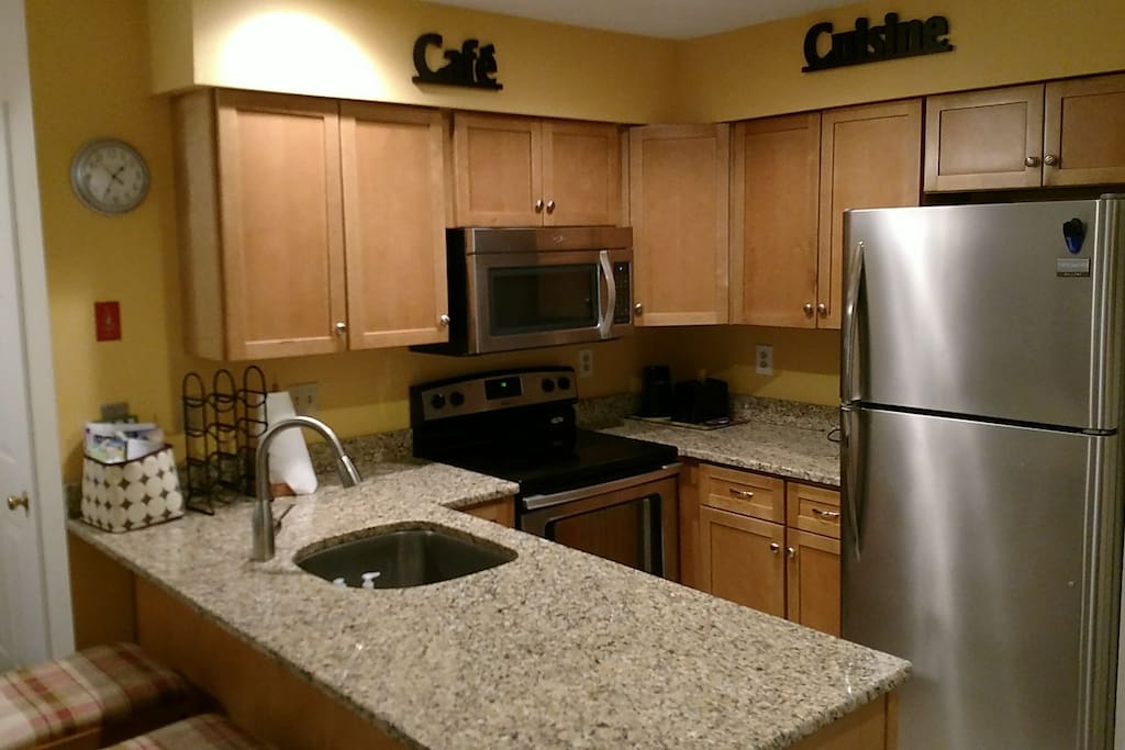Complete kitchen w stove, microwave, dishwasher, fridge, toaster, coffee maker, cookware, cutlery, dishes etc.