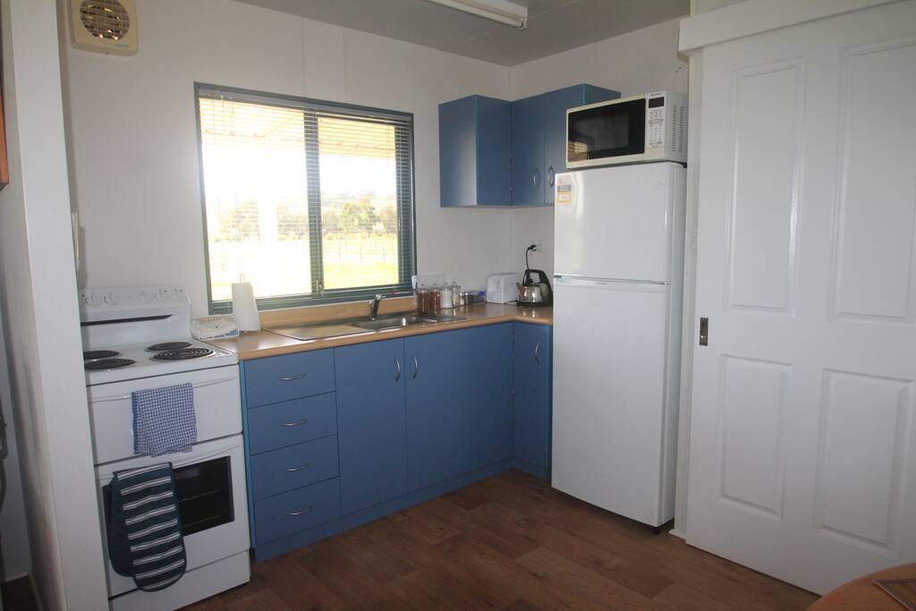 Fully self contained kitchen, stove, microwave,, large fridge.
