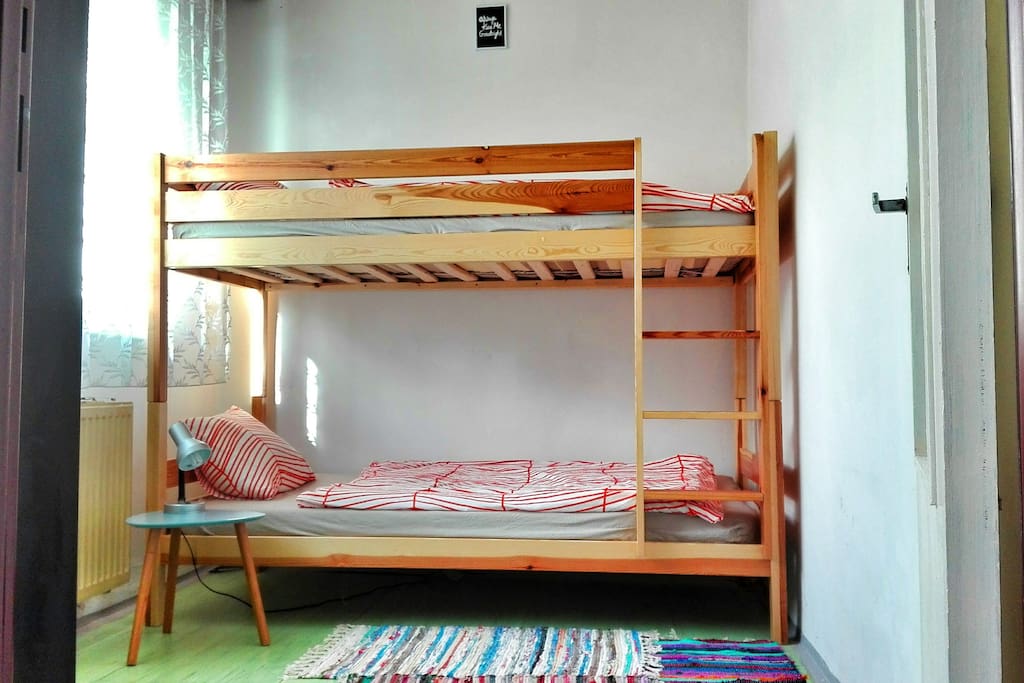 bedroom with tank bed and cupboard