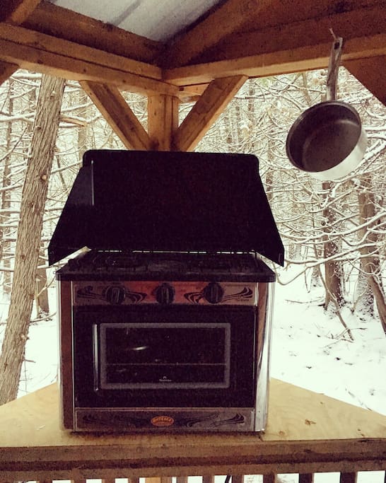 Prepare your meals on the porch with the propane stove and oven!