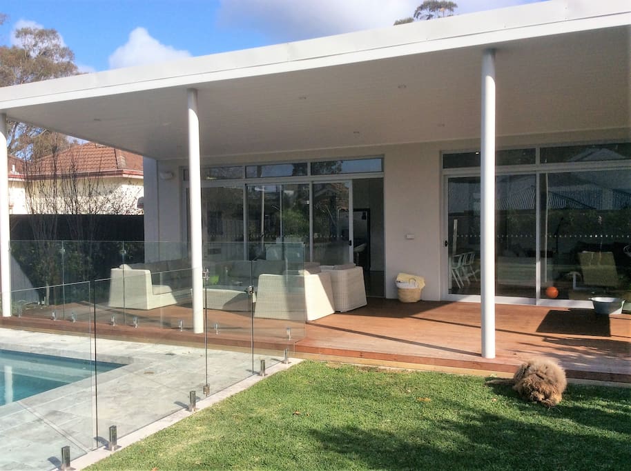 Outdoor decking overlooking pool and garden