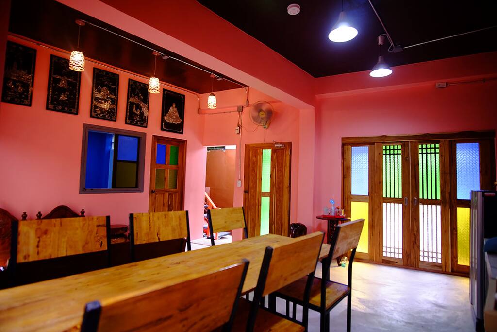 Common area is decorated with colorful glass windows and doors.