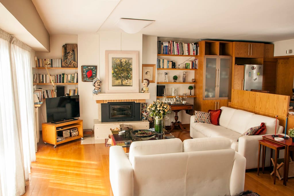 Living room with fireplace and city view