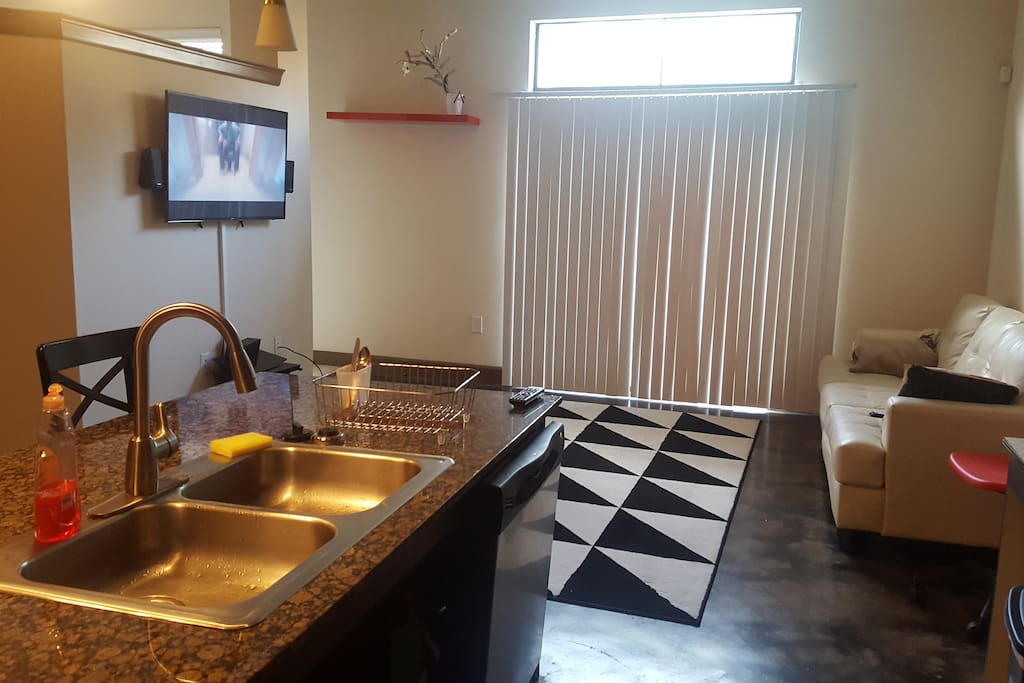 Cook some dinner in this convenient double sink with marble island and seats