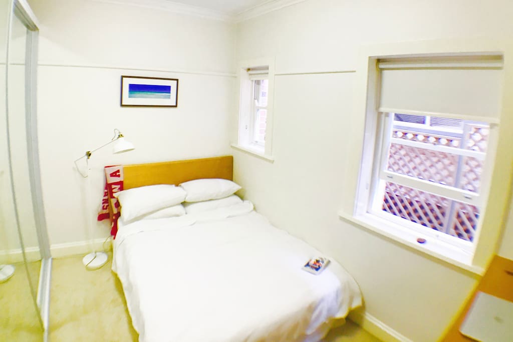 Sweet double room with clean white sheets, natural light and a heater for colder nights.