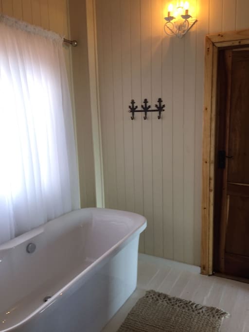 Bathroom with inter-leading door to the outside shower