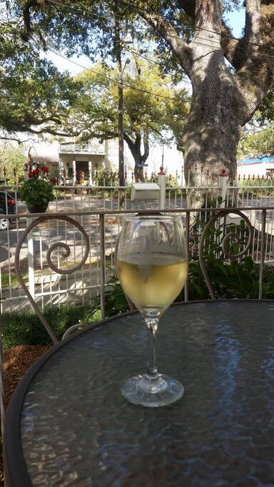 Wine on the front porch, complete with swing and chairs for 6