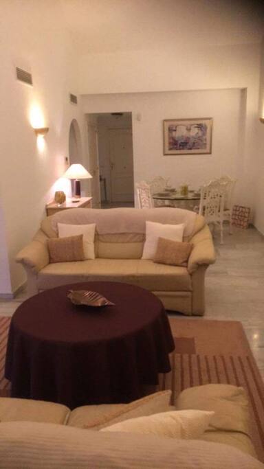 Large sunny aspect lounge with large terrace off with table chairs and BBQ