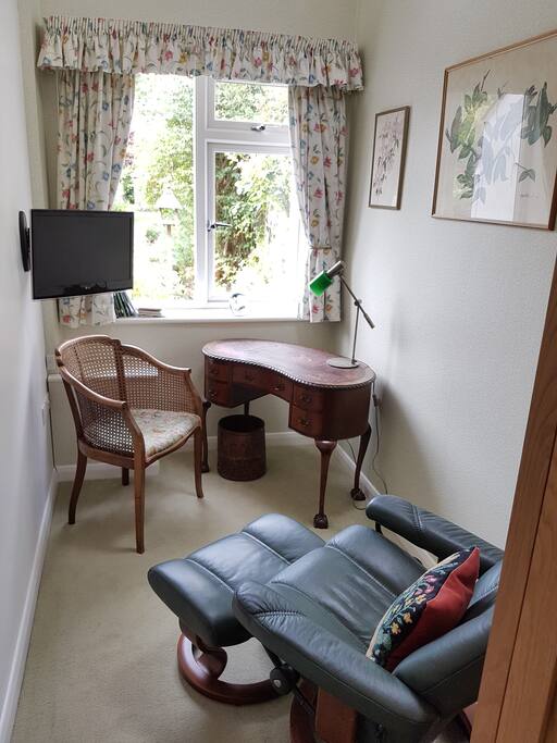 Living area with easy chair and desk
