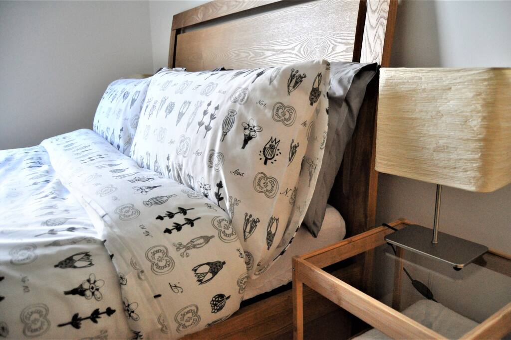 Either side of the bed there are electrical sockets for easy charging. Together with bed side tables and lamps.