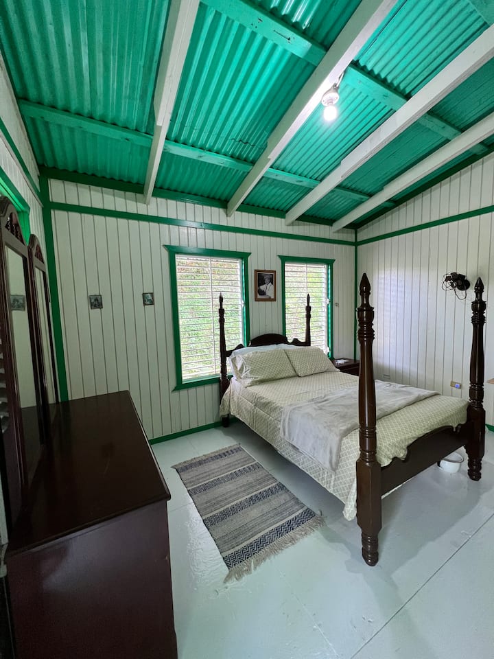 Main room with full pillar bed.