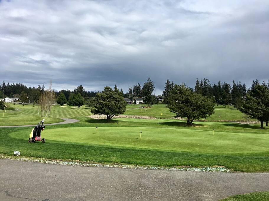Putting green, driving range, and 18 hole golf course with Rockaway Bar and Grill and Pub 282 nearby