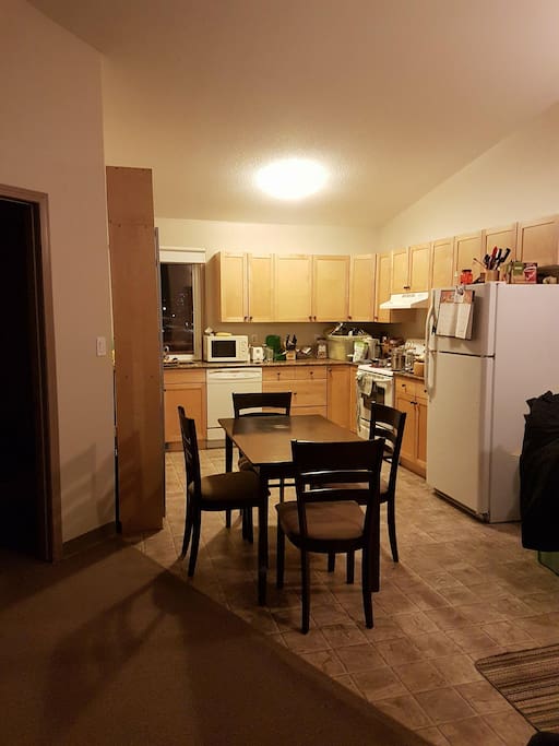 The kitchen is shared. The guest bedroom is on the left, and the master bedroom is on the other end of the building.