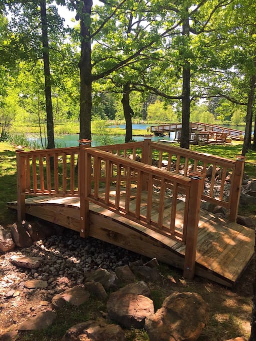 Footbridge over the dry creek bed by the pond.