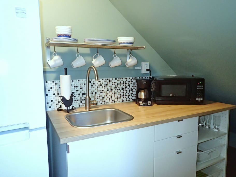 Modern kitchenette with microwave, toaster, coffeemaker and electric kettle (no stove or oven cooking)