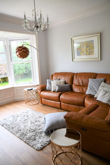 Lounge with recliner corner sofa and bay windows
