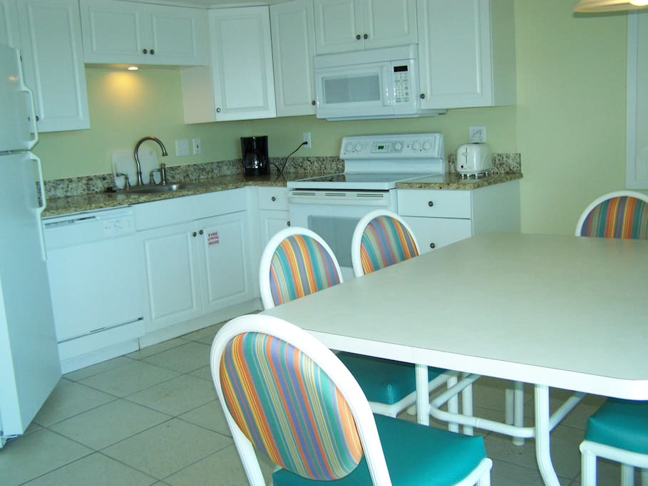 Fully Equipped Kitchen with Bright Dining Area