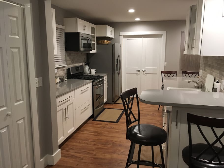 The kitchen has an eating area at each end of the counter.