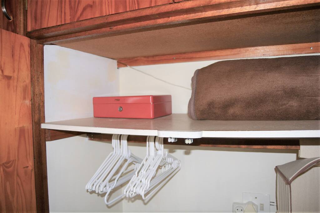 Money Box safe and clothes hangers inside closet