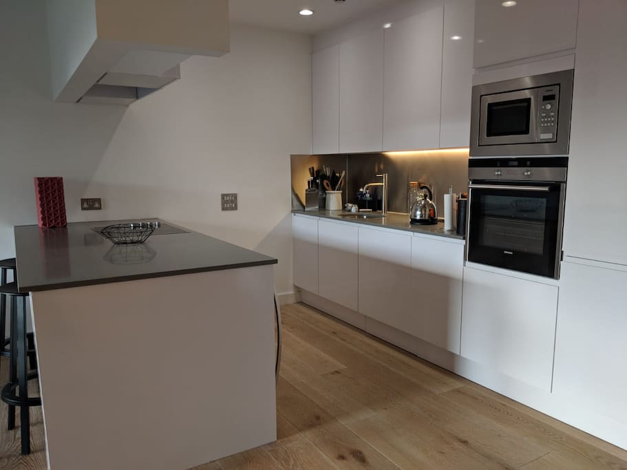 open plan kitchen with all modern appliances and wine cooler.