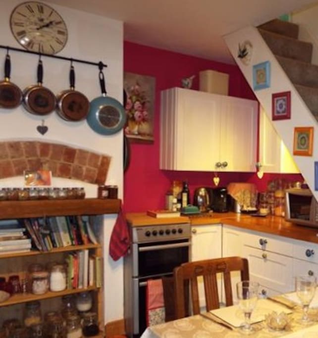 The kitchen, stocked with spices and baking ingredients, coffee maker and tassimo coffee pods at 40p each.