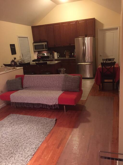 Common area/open lay-out kitchen and dining pub upon entering.