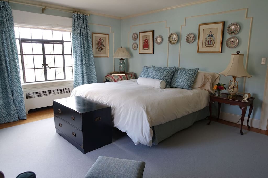 Bright, sunny main guestroom with king bed.