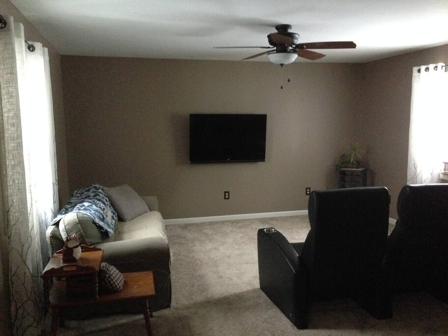 Entertainment area just off the living room includes Roku and theatre seating.