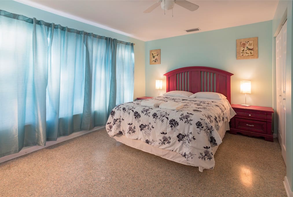 The tall, comfy, queen size bed in our Magenta room is adorned by artisanal furniture by Erica Zylman