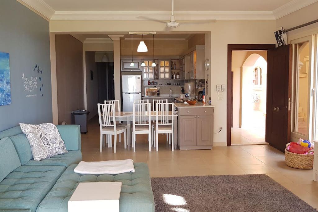 Private entrance into a cozy open kitchen and living space leading to the bedrooms & bathrooms