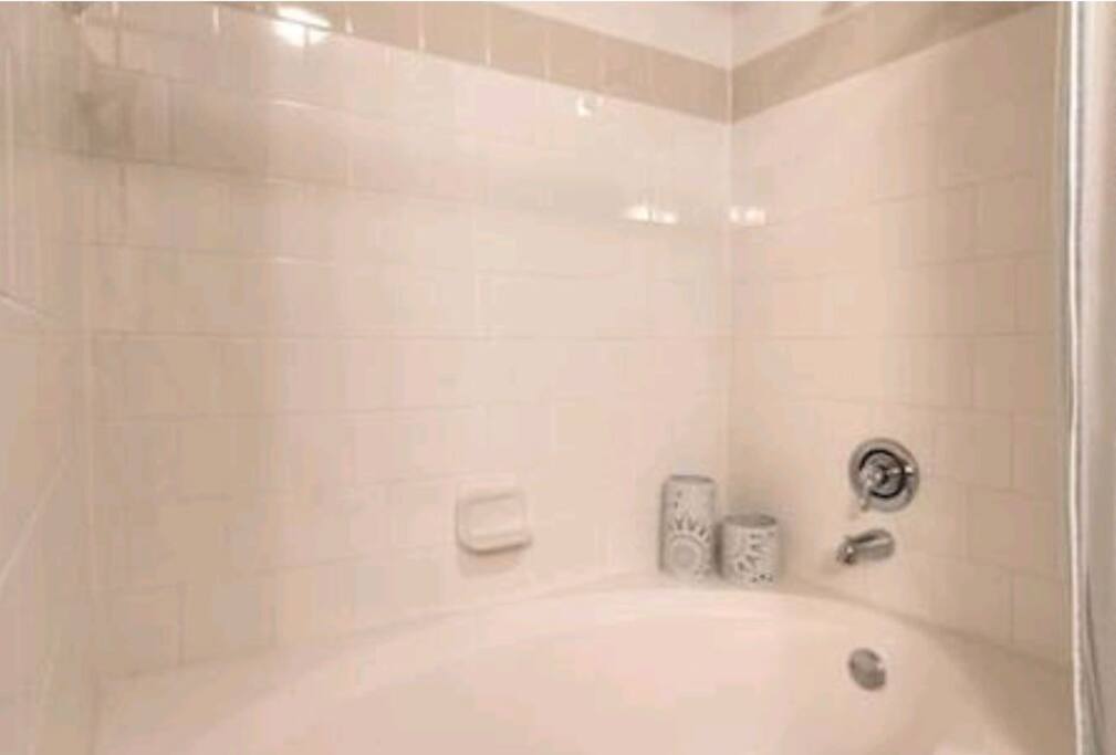 Big bathtub and shower for relaxation!