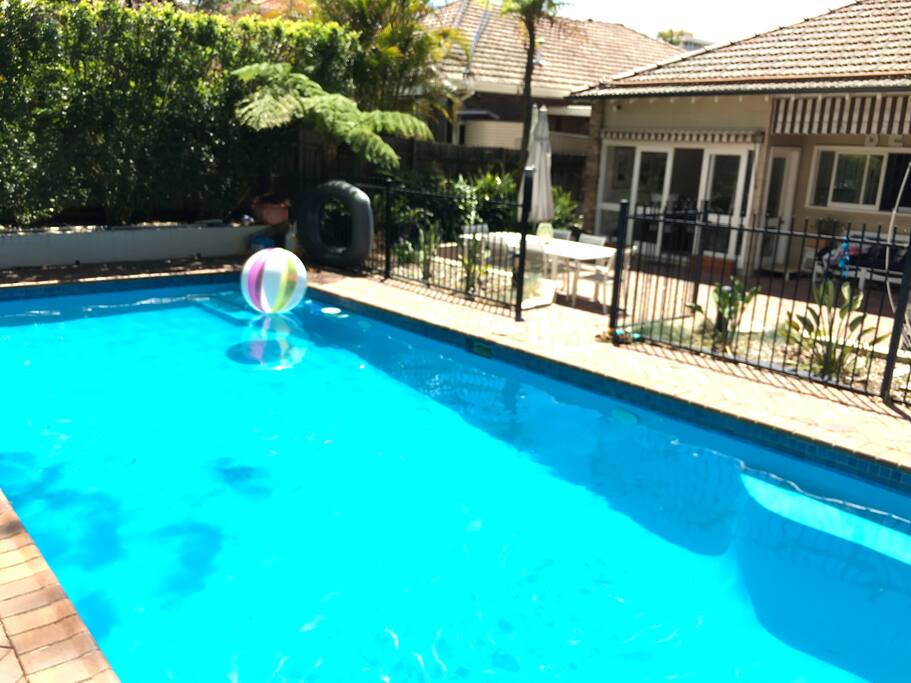 Back of house, fully enclosed tiled courtyard with fenced pool area. Outdoor laundry & second toilet / & basic shower / Gas Weber Barbeque - connected to mains so no gas bottle issues - which you are welcome to use / trampoline & basketball net / outdoor lounge / outdoor table & chairs for 8 with second dining table inside with 6 seats