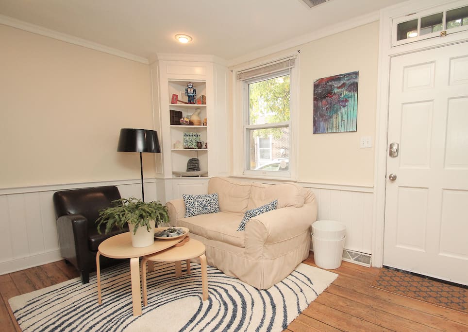 Comfortable living room with Roku/TV and original artwork. Personality and charm sprinkled throughout the home.