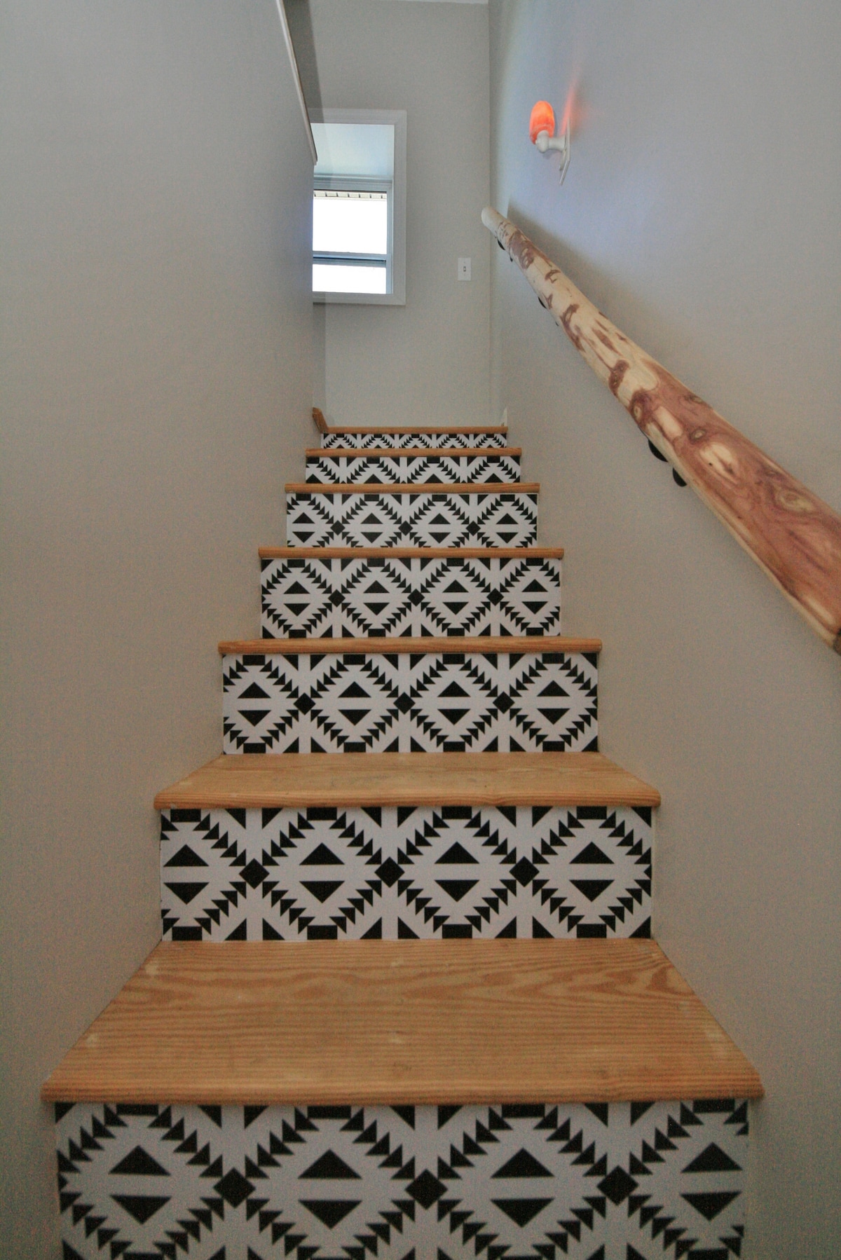 Our property has an abundance of cedar trees and this stair railing was hand carved on site