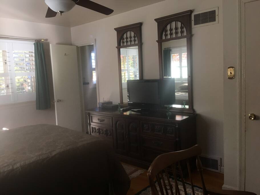 Master Bedroom looks out over backyard with pool available in summer.